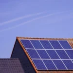 Modern Suburban home in US with high-efficiency solar panels installed on the roof.