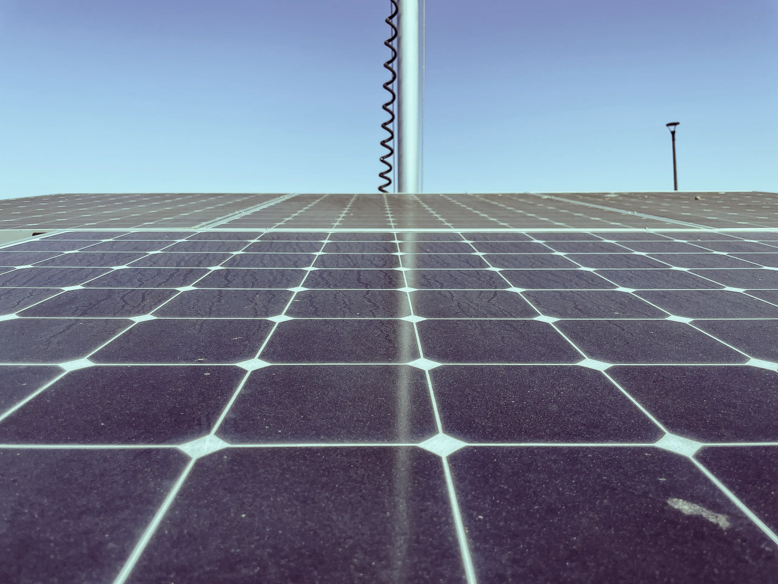 Dirty Solar Panels Increase Electric Bill. Dust and pollen buildup on a residential rooftop solar panel reducing energy output.
