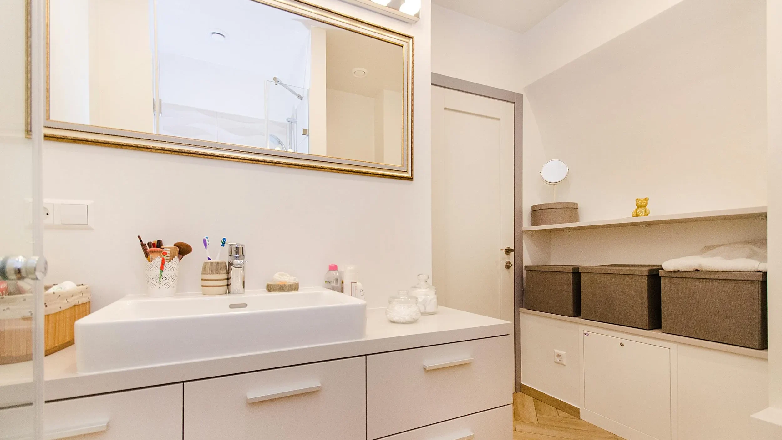 Organized bathroom storage creating a clean spa-like atmosphere