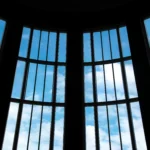 Transparent solar window converting sunlight into electricity in modern home