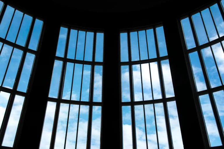 Transparent solar window converting sunlight into electricity in modern home