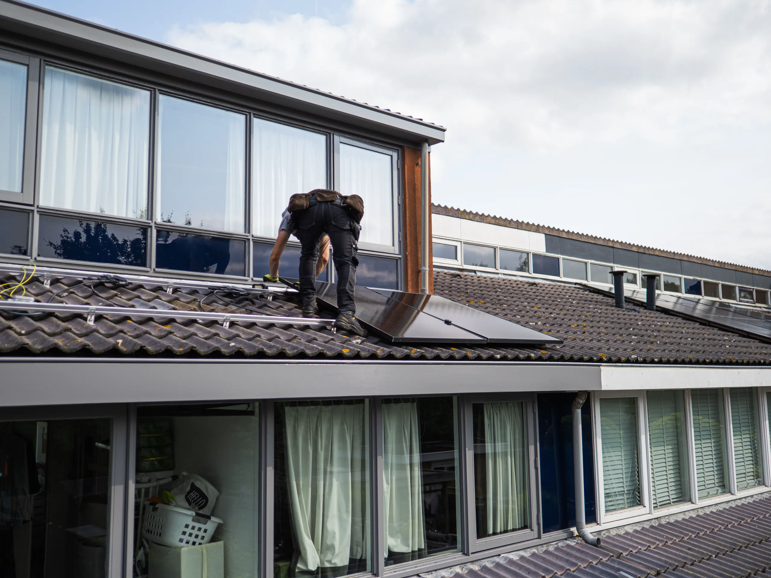Roof inspection checklist before installing solar panels, checking shingle condition and remaining lifespan
