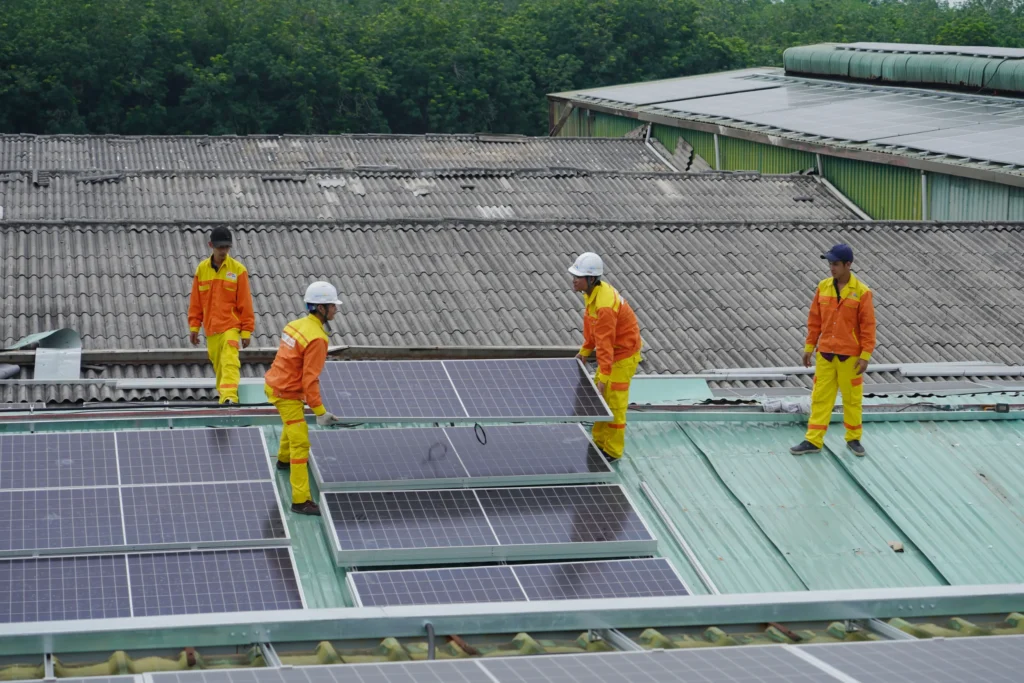 Solar panels being removed from a roof to allow for reroofing before reinstallation.
