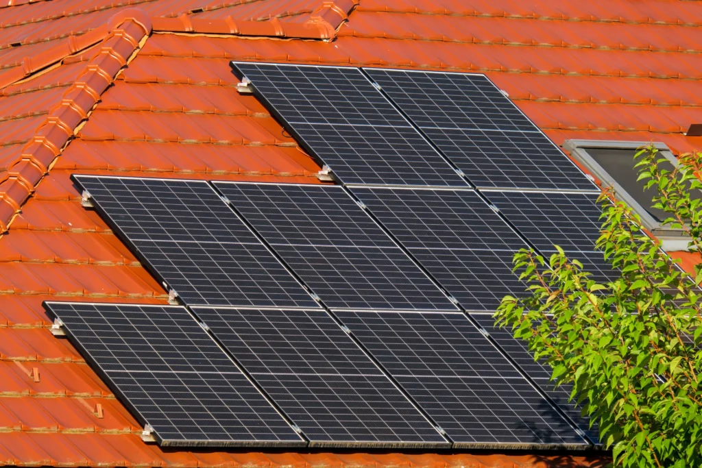 new roof before going solar. Standing seam metal roof with clamp-mounted solar panels requiring no roof penetrations.
